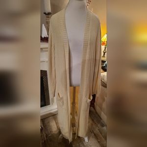 Long cream colored duster sweater.